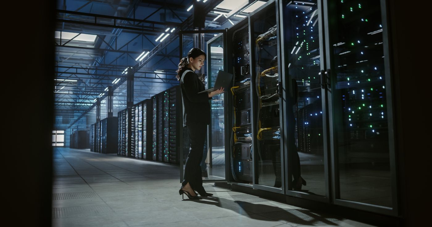 A technician checking backup systems in a data center