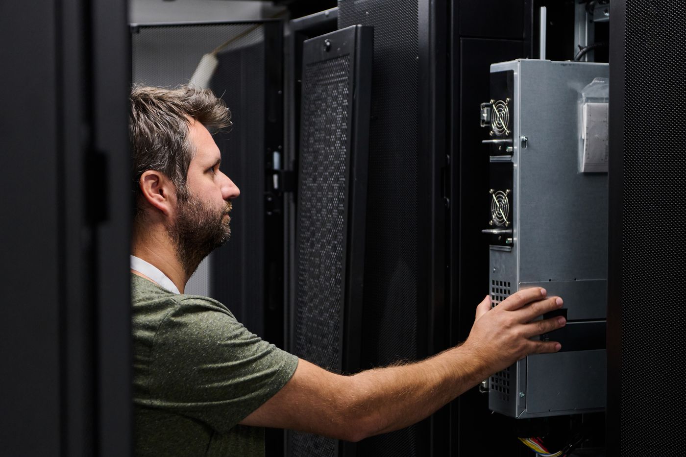 A technician installing server hardware during a project